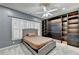 Charming bedroom features neutral walls, soft carpet, and dark built-in shelving at 3565 Hickory Branch Trl, Suwanee, GA 30024