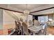 Dining room with stairs and piano in the background, plenty of space for entertaining at 3565 Hickory Branch Trl, Suwanee, GA 30024
