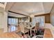 Open dining area flowing into a living room with lots of natural light and modern fixtures at 3565 Hickory Branch Trl, Suwanee, GA 30024