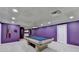Finished basement game room with a pool table and stylish purple walls at 3565 Hickory Branch Trl, Suwanee, GA 30024