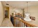 Open hallway with hardwood stairs, decorative light fixture, and neutral walls at 3565 Hickory Branch Trl, Suwanee, GA 30024