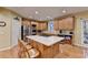 Kitchen with stainless steel appliances, wood cabinets, kitchen island with breakfast bar at 3565 Hickory Branch Trl, Suwanee, GA 30024