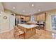 Bright kitchen featuring a large island, stainless steel appliances, and ample cabinet space at 3565 Hickory Branch Trl, Suwanee, GA 30024