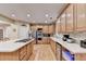 Well-lit kitchen with island, modern appliances, and ample counter space at 3565 Hickory Branch Trl, Suwanee, GA 30024