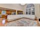 Bright living room with an extra large sectional and an open kitchen at 3565 Hickory Branch Trl, Suwanee, GA 30024