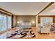 Bright living room features hardwood floors, large windows, and decorative columns and trim at 3565 Hickory Branch Trl, Suwanee, GA 30024