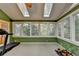 Bright sunroom with skylights and large windows providing wooded views at 3565 Hickory Branch Trl, Suwanee, GA 30024