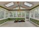 Bright sunroom with skylights and large windows providing wooded views at 3565 Hickory Branch Trl, Suwanee, GA 30024