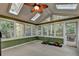 Bright sunroom with skylights and large windows providing wooded views at 3565 Hickory Branch Trl, Suwanee, GA 30024