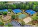 Aerial image of the community tennis courts, playground, and volleyball area at 3565 Hickory Branch Trl, Suwanee, GA 30024