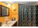 Bright bathroom showcasing a stylish vanity and floral shower curtain at 4256 Village Square Ln, Stone Mountain, GA 30083