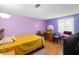 Comfortable bedroom featuring hardwood floors and ample natural light at 4256 Village Square Ln, Stone Mountain, GA 30083