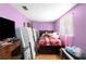 A cozy bedroom featuring a comfortable bed and good lighting at 4256 Village Square Ln, Stone Mountain, GA 30083