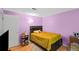 Bedroom featuring laminate floors, soft lighting, and neutral paint at 4256 Village Square Ln, Stone Mountain, GA 30083