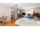 Bright bedroom showcasing hard wood floors, an ensuite and a spacious design at 4256 Village Square Ln, Stone Mountain, GA 30083