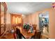 Elegant dining room featuring hardwood floors, ample seating, and bright natural light at 4256 Village Square Ln, Stone Mountain, GA 30083