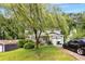 Charming two-story home featuring an attached garage, mature landscaping, and an inviting front entrance at 4256 Village Square Ln, Stone Mountain, GA 30083