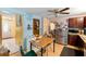 A kitchen with stainless steel appliances, a ceiling fan, and an adjacent dining area at 4256 Village Square Ln, Stone Mountain, GA 30083