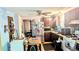 Kitchen with stainless steel appliances, dark cabinetry, and an adjacent dining area at 4256 Village Square Ln, Stone Mountain, GA 30083
