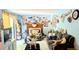 Living room with a decorative fireplace, blue walls and plenty of decorations at 4256 Village Square Ln, Stone Mountain, GA 30083