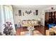 Living room with hardwood floors, antique furniture, and decorative wall hangings at 4256 Village Square Ln, Stone Mountain, GA 30083