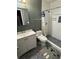 Stylish bathroom featuring a shower with white subway tile and decorative gray accent wall at 190 Grayland Creek Dr, Lawrenceville, GA 30046