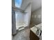 Bright bathroom featuring a bathtub under a skylight and neutral finishes at 190 Grayland Creek Dr, Lawrenceville, GA 30046
