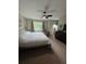 Bedroom featuring a large window, neutral colors, and a ceiling fan at 190 Grayland Creek Dr, Lawrenceville, GA 30046