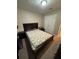 Cozy bedroom with a comfortable bed and carpet floors at 190 Grayland Creek Dr, Lawrenceville, GA 30046