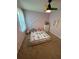 bedroom featuring pink walls, a colorful ceiling fan, and a unique house frame bed at 190 Grayland Creek Dr, Lawrenceville, GA 30046