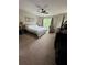Bedroom featuring a large window, neutral colors, and a ceiling fan at 190 Grayland Creek Dr, Lawrenceville, GA 30046