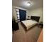 Inviting bedroom featuring a comfortable bed and dresser with dark curtains at 190 Grayland Creek Dr, Lawrenceville, GA 30046
