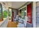 Inviting front porch with rocking chairs, and red shutters at 190 Grayland Creek Dr, Lawrenceville, GA 30046