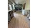 Bright kitchen featuring wood floors, stainless steel appliances, and a modern mural wall at 190 Grayland Creek Dr, Lawrenceville, GA 30046