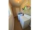 Well-lit laundry room with modern appliances and ample space, wood flooring at 190 Grayland Creek Dr, Lawrenceville, GA 30046
