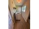 Functional laundry room with a modern washer, dryer, and wood-look flooring at 190 Grayland Creek Dr, Lawrenceville, GA 30046