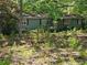 Quaint single-story home with a wooded front yard, perfect for nature lovers at 225 Oglesby Bridge Rd Se, Conyers, GA 30094