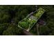 Aerial view showing a home's acreage surrounded by lush trees at 2709 Windrush Dr, Buford, GA 30518
