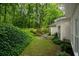 Secluded backyard with lush greenery and a charming patio area, perfect for outdoor relaxation at 2709 Windrush Dr, Buford, GA 30518