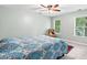 Bright bedroom with a comfortable chair and windows that bring in lots of natural light at 2709 Windrush Dr, Buford, GA 30518