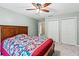Comfortable bedroom with a ceiling fan and double closets, providing ample storage space at 2709 Windrush Dr, Buford, GA 30518