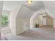 Bonus room with dormer ceilings, and natural light from the window makes it the perfect multi-purpose space at 2709 Windrush Dr, Buford, GA 30518