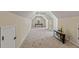 Spacious bonus room with neutral carpet, a small window, and ample space for activities at 2709 Windrush Dr, Buford, GA 30518