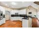 Open kitchen boasts stainless appliances, granite counters, and a seamless transition to the living area at 2709 Windrush Dr, Buford, GA 30518
