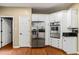 Kitchen features stainless steel appliances, ample cabinet space, and hardwood floors at 2709 Windrush Dr, Buford, GA 30518