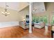 Bright living room featuring a fireplace, hardwood floors, and comfortable seating at 2709 Windrush Dr, Buford, GA 30518