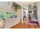Open-concept living room with hardwood floors, high ceilings, and ample natural light at 2709 Windrush Dr, Buford, GA 30518