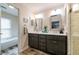Modern bathroom with double vanity, framed mirrors, updated fixtures, and a separate tub and shower at 3833 Savannah E Sq, Atlanta, GA 30340