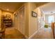 Hallway with neutral tones, closet, and hardwood floors provide a welcoming transition between rooms at 3833 Savannah E Sq, Atlanta, GA 30340