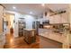 Well-equipped kitchen featuring stainless steel appliances, granite countertops, and a kitchen island at 3833 Savannah E Sq, Atlanta, GA 30340